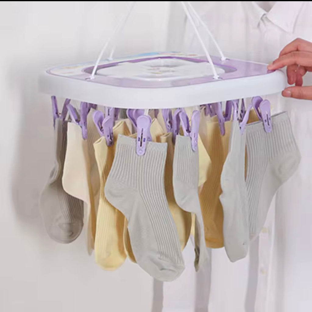 Multi-Clip Drying Rack features 20 pegs and a 360° rotating hook