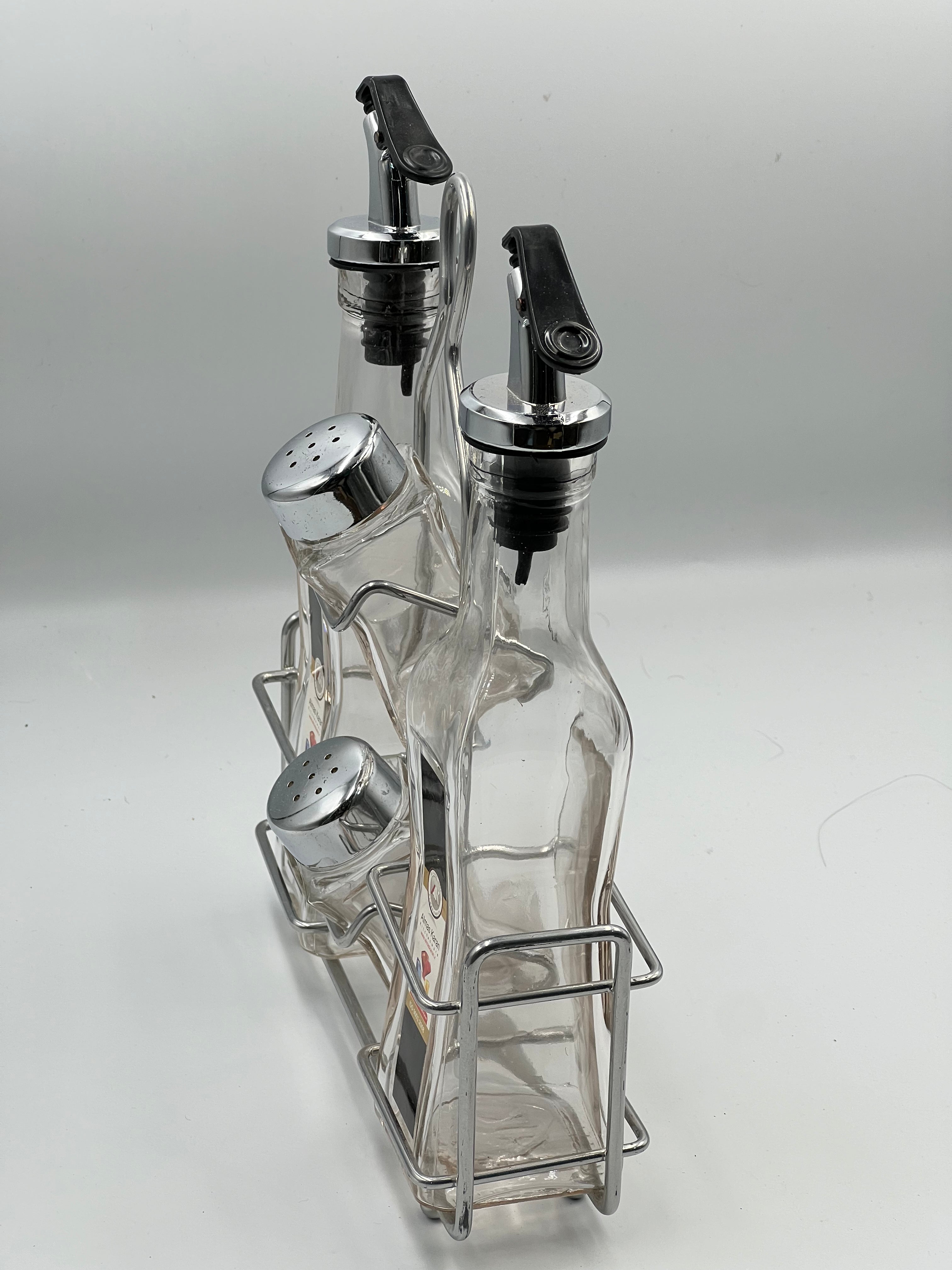 مجموعة زجاجات الزيت والتوابل الأنيقة مع رف فولاذي