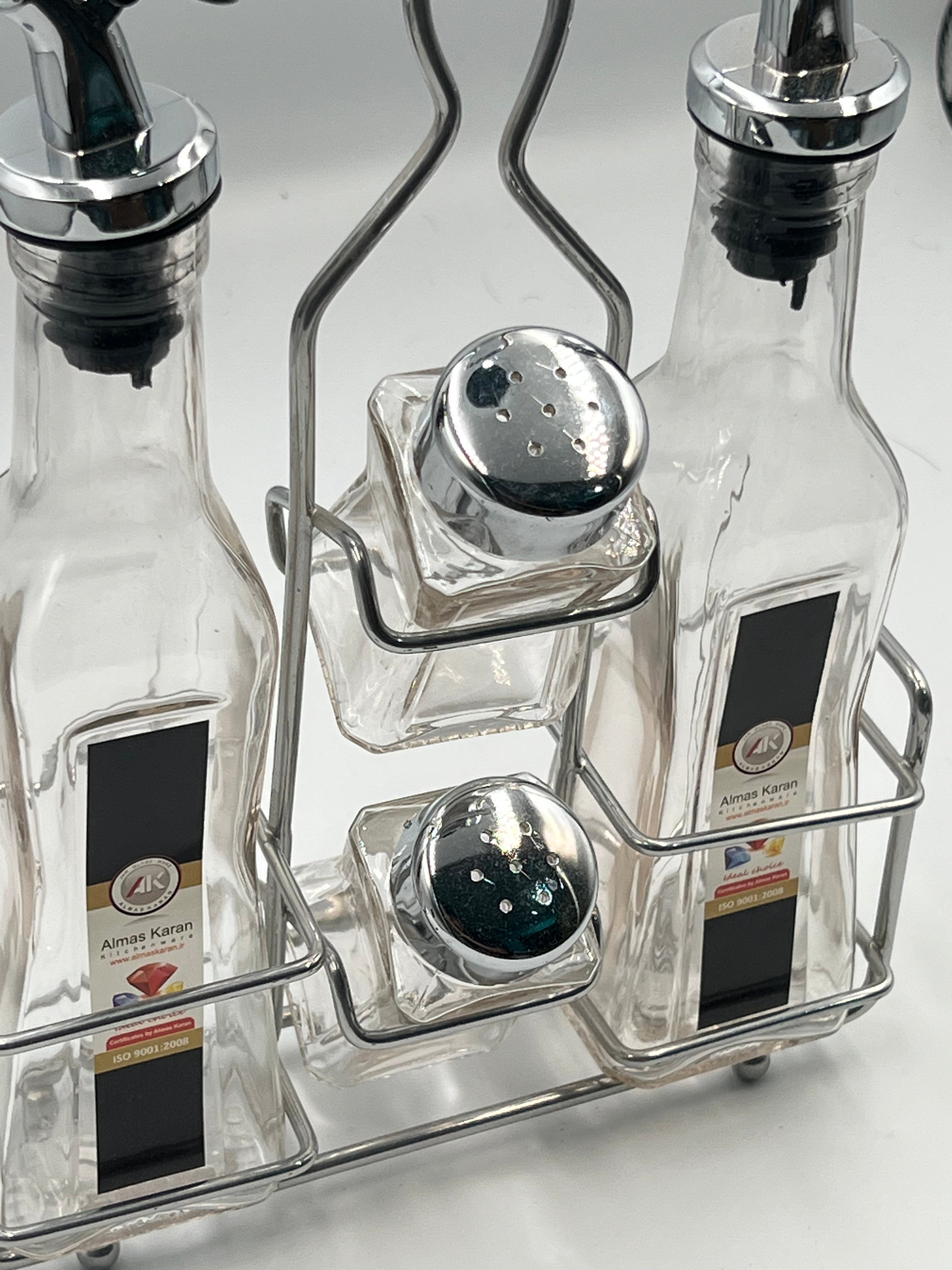 مجموعة زجاجات الزيت والتوابل الأنيقة مع رف فولاذي