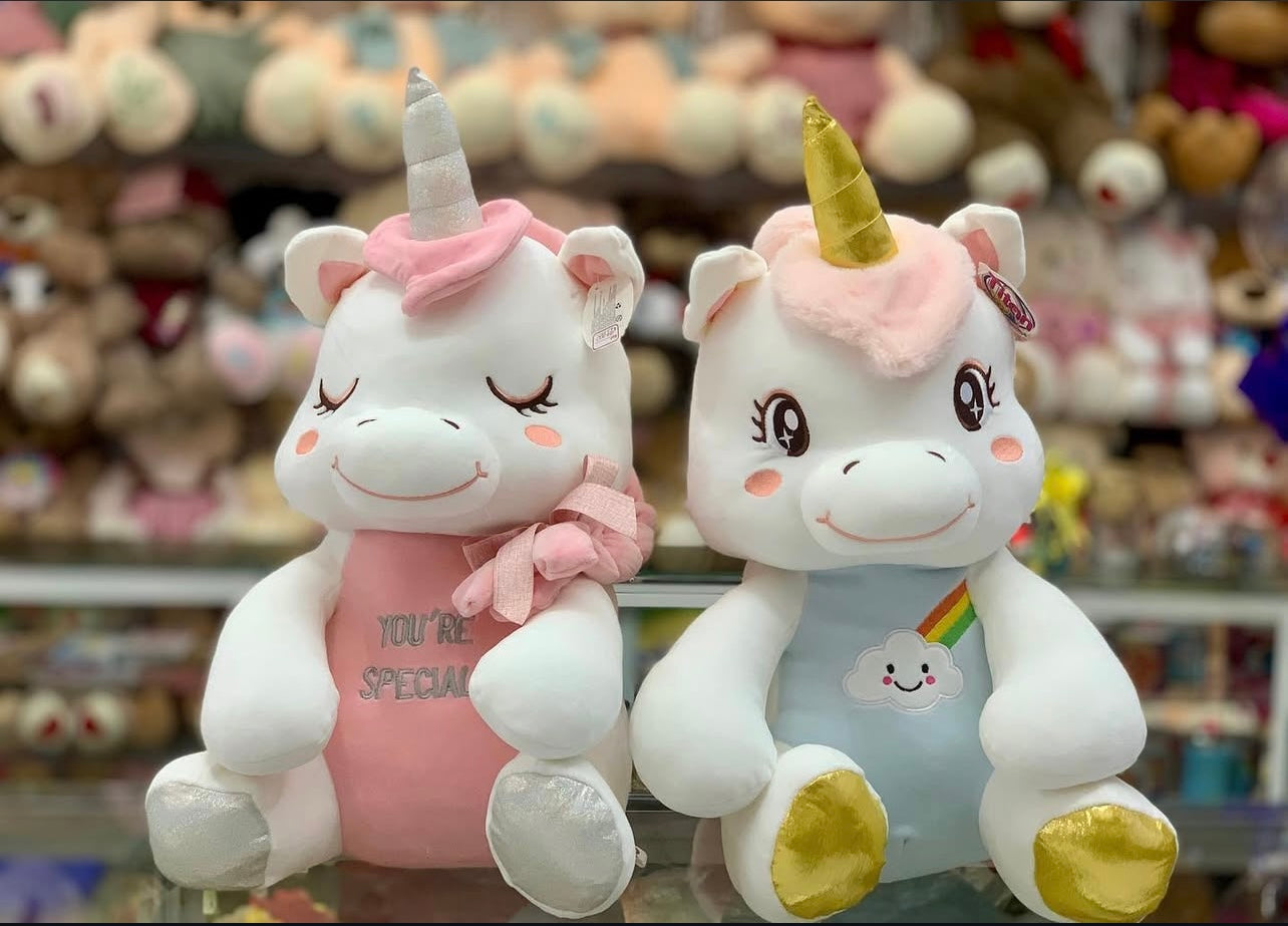 These pink and blue unicorn plush toys are soft and cuddly, perfect for children and unicorn lovers..