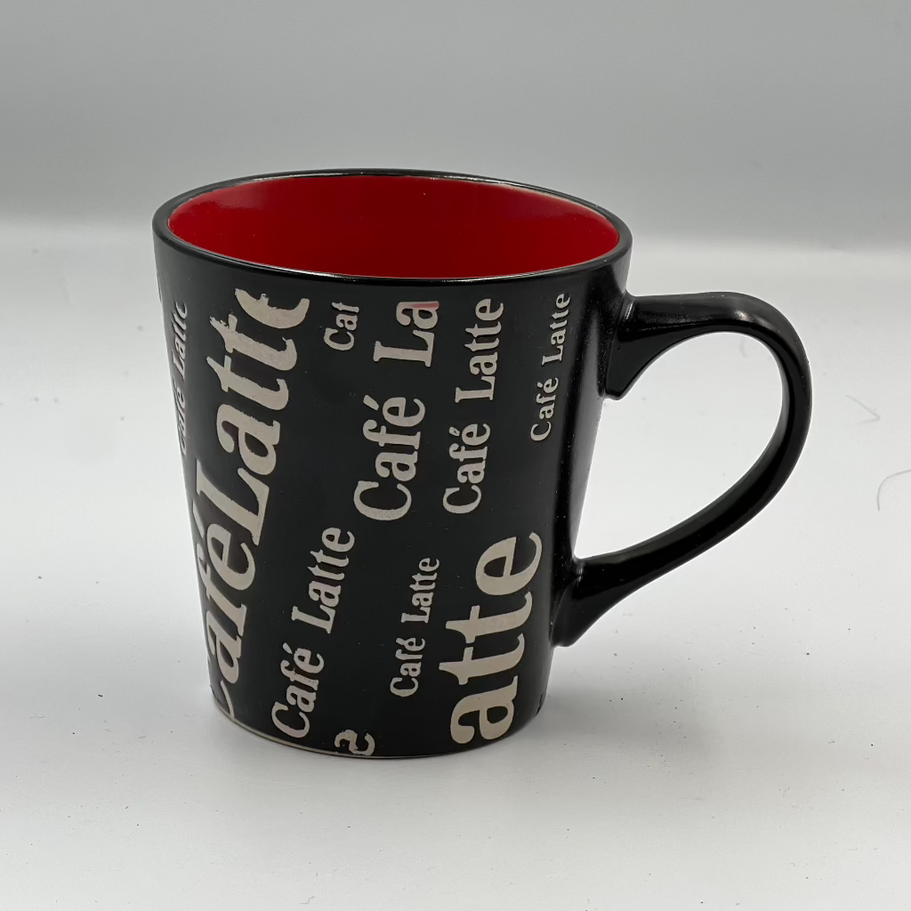 coffee in style with this bold Café Latte ceramic mug. Featuring a sleek black finish with vibrant red interior, it’s perfect for home or office,Tea Cup, trendy, and ideal for gifting to any coffee lover!”
