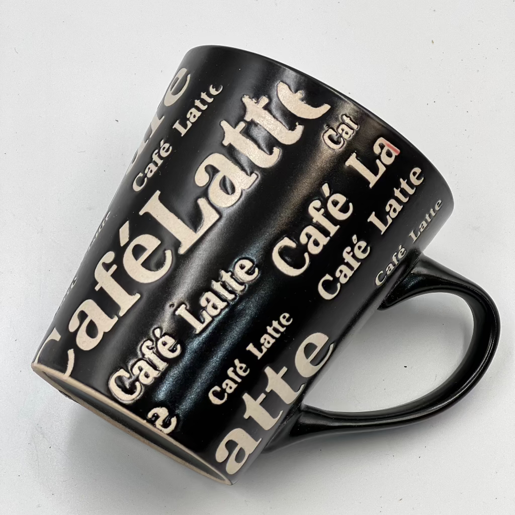 coffee in style with this bold Café Latte ceramic mug. Featuring a sleek black finish with vibrant red interior, it’s perfect for home or office,Tea Cup, trendy, and ideal for gifting to any coffee lover!”