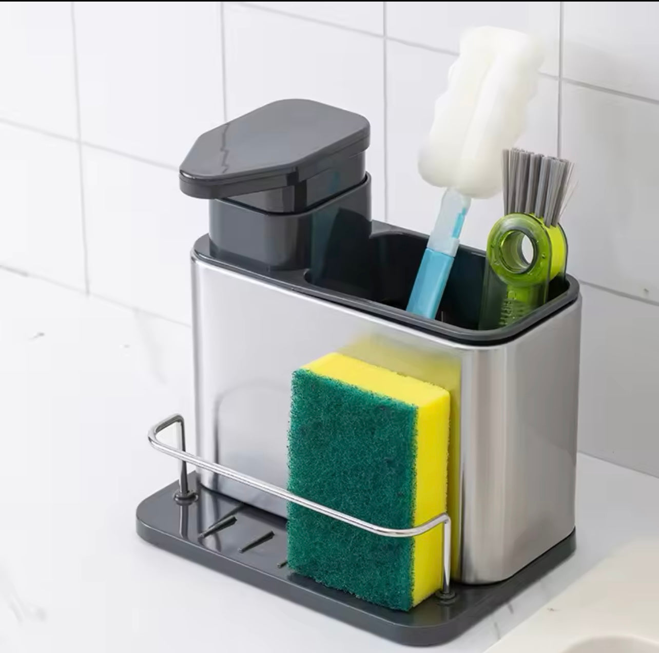 Kitchen Storage Rack Made of Stainless Steel, Featuring a Detergent Dispenser, a Sponge Holder, And a Utensil Rack with a Drainage Tray. It Is Durable, Resistant to Rust, And Ideal for Use by The Kitchen Sink,