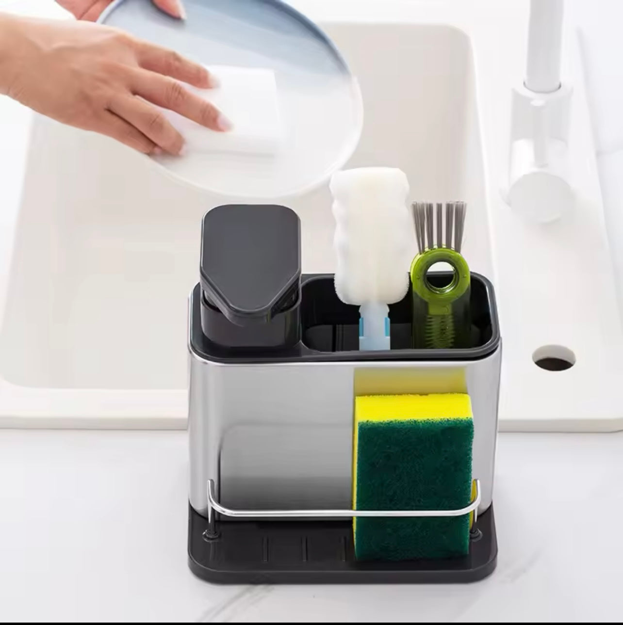 Kitchen Storage Rack Made of Stainless Steel, Featuring a Detergent Dispenser, a Sponge Holder, And a Utensil Rack with a Drainage Tray. It Is Durable, Resistant to Rust, And Ideal for Use by The Kitchen Sink,