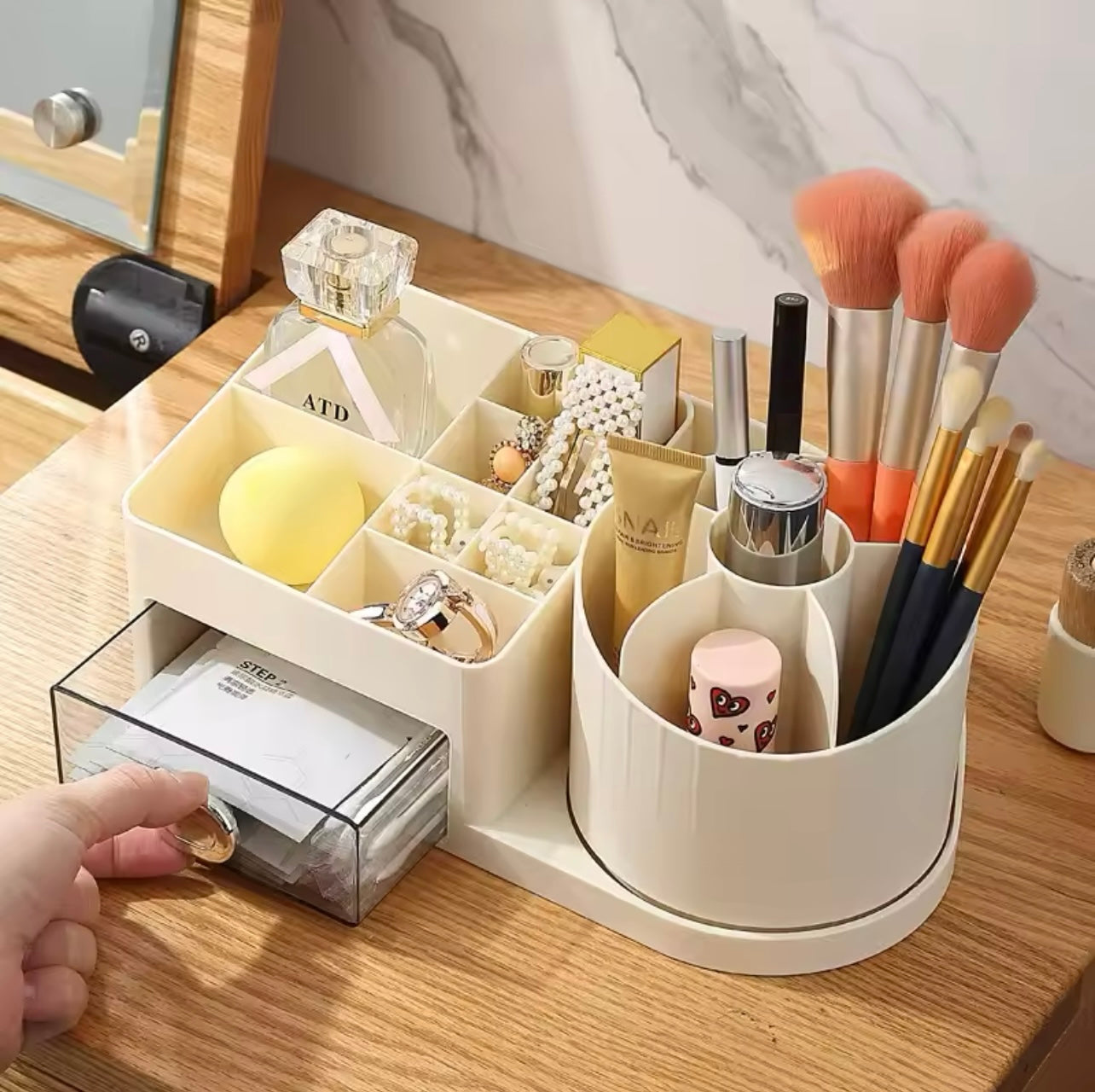 A 360° rotating cosmetic storage box - a multifunctional desktop organizer with multiple compartments, featuring drawers for storing lipsticks, perfumes, makeup brushes, skincare products, and stationery. No power source or batteries required.