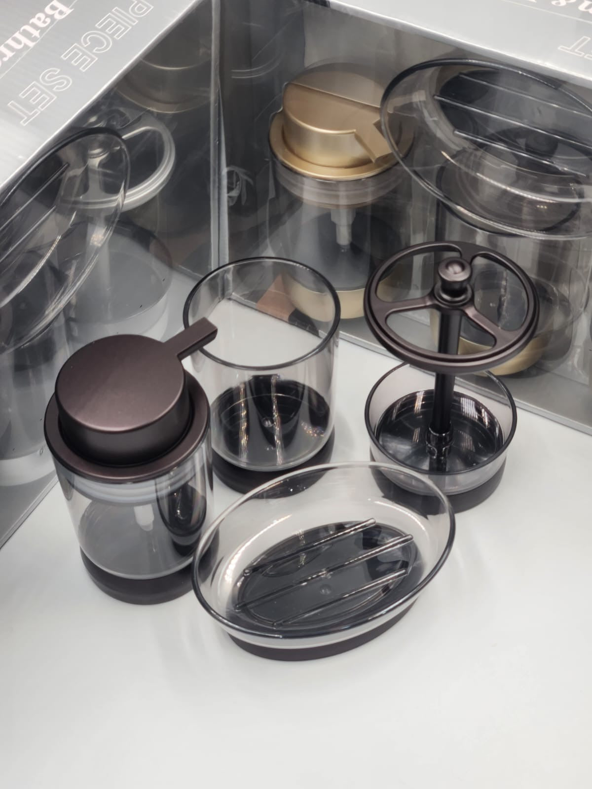 4-in-1 acrylic bathroom organizer set with soap dispenser, toothbrush holder,storage canister, toilet brush, and soap dish.