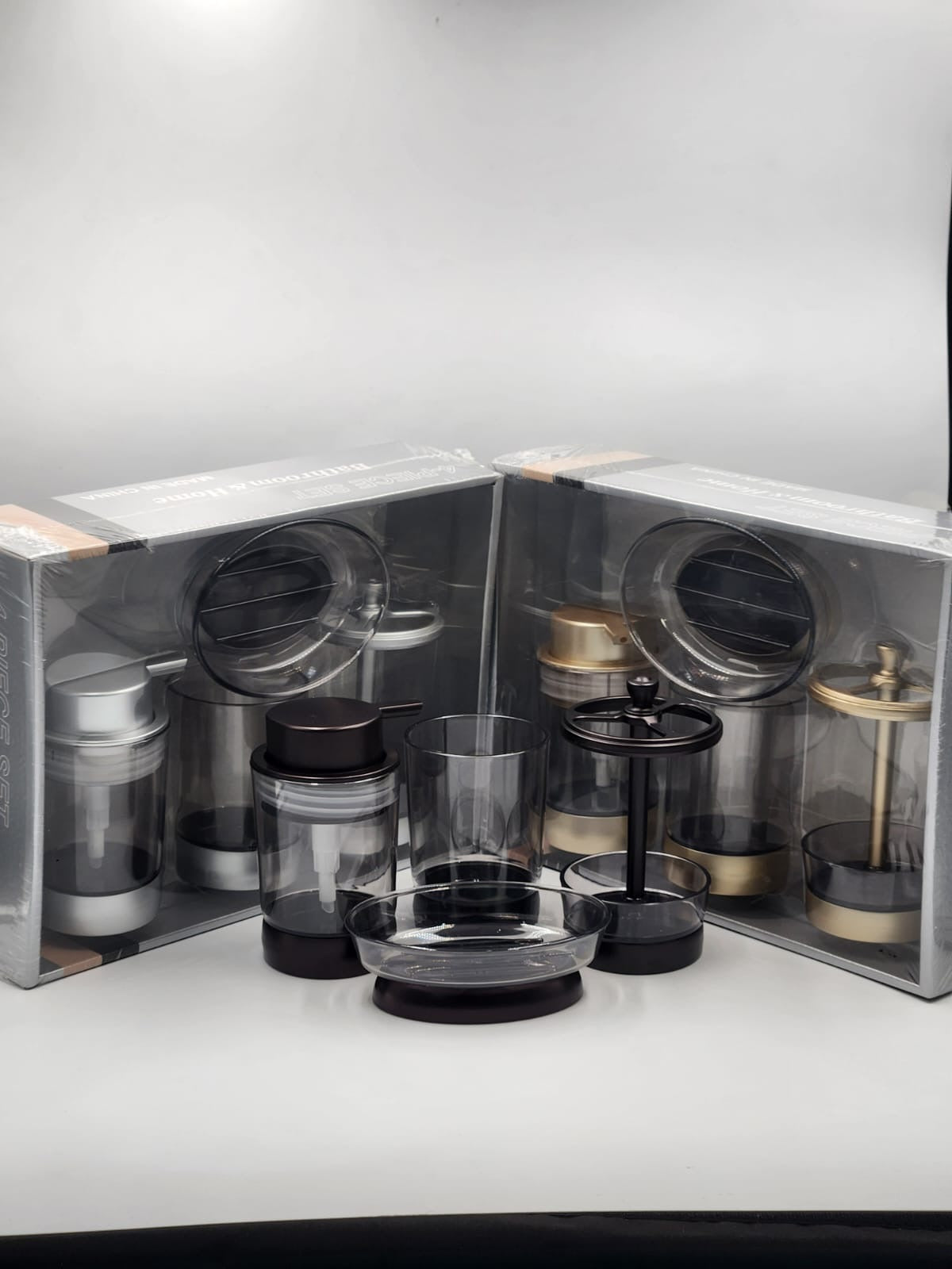 4-in-1 acrylic bathroom organizer set with soap dispenser, toothbrush holder,storage canister, toilet brush, and soap dish.