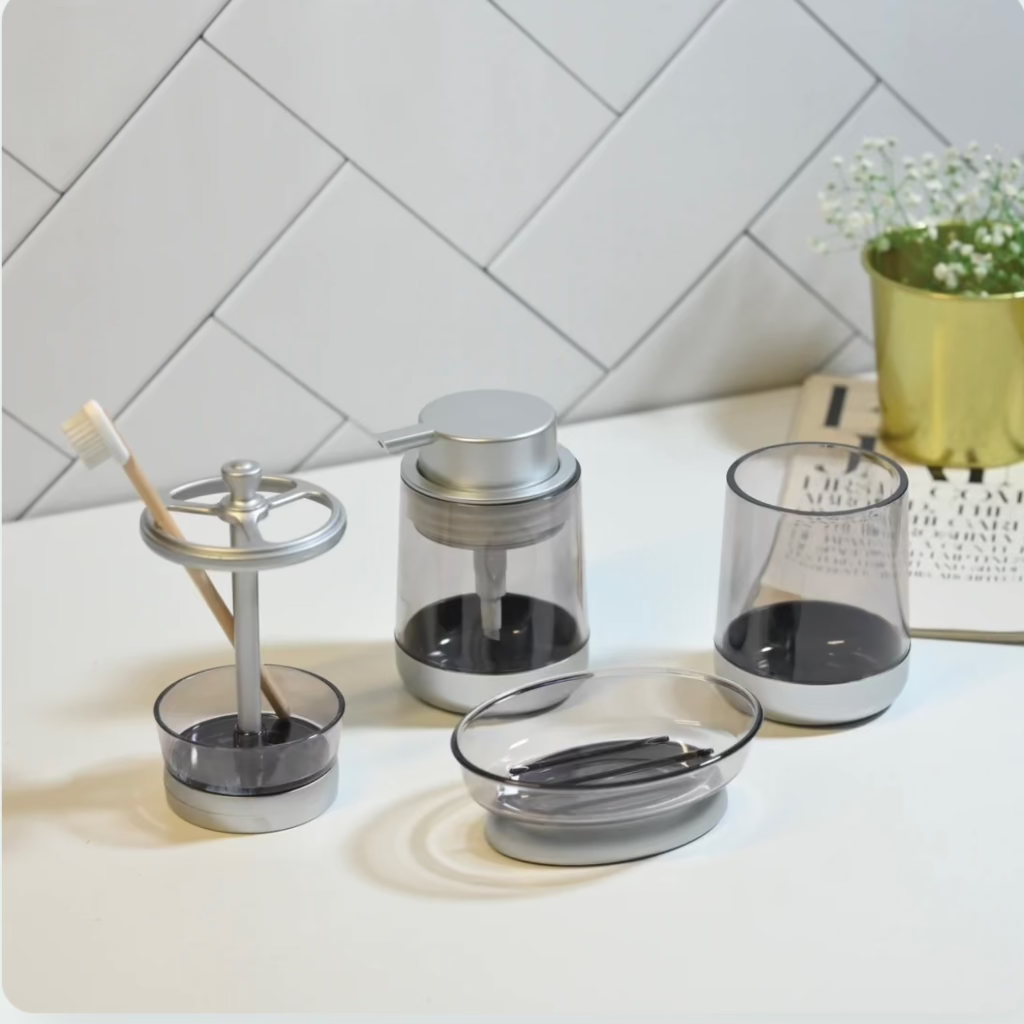 4-in-1 acrylic bathroom organizer set with soap dispenser, toothbrush holder,storage canister, toilet brush, and soap dish.